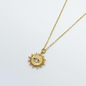 Gold Sunburst Eye Pendant Necklace